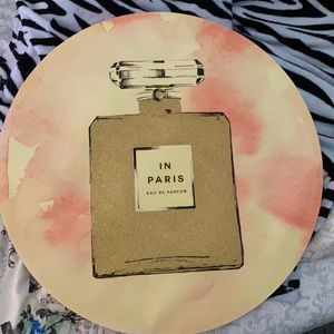 Brand - bebe, it’s wall decor, colors - pink & white with gold in the middle.